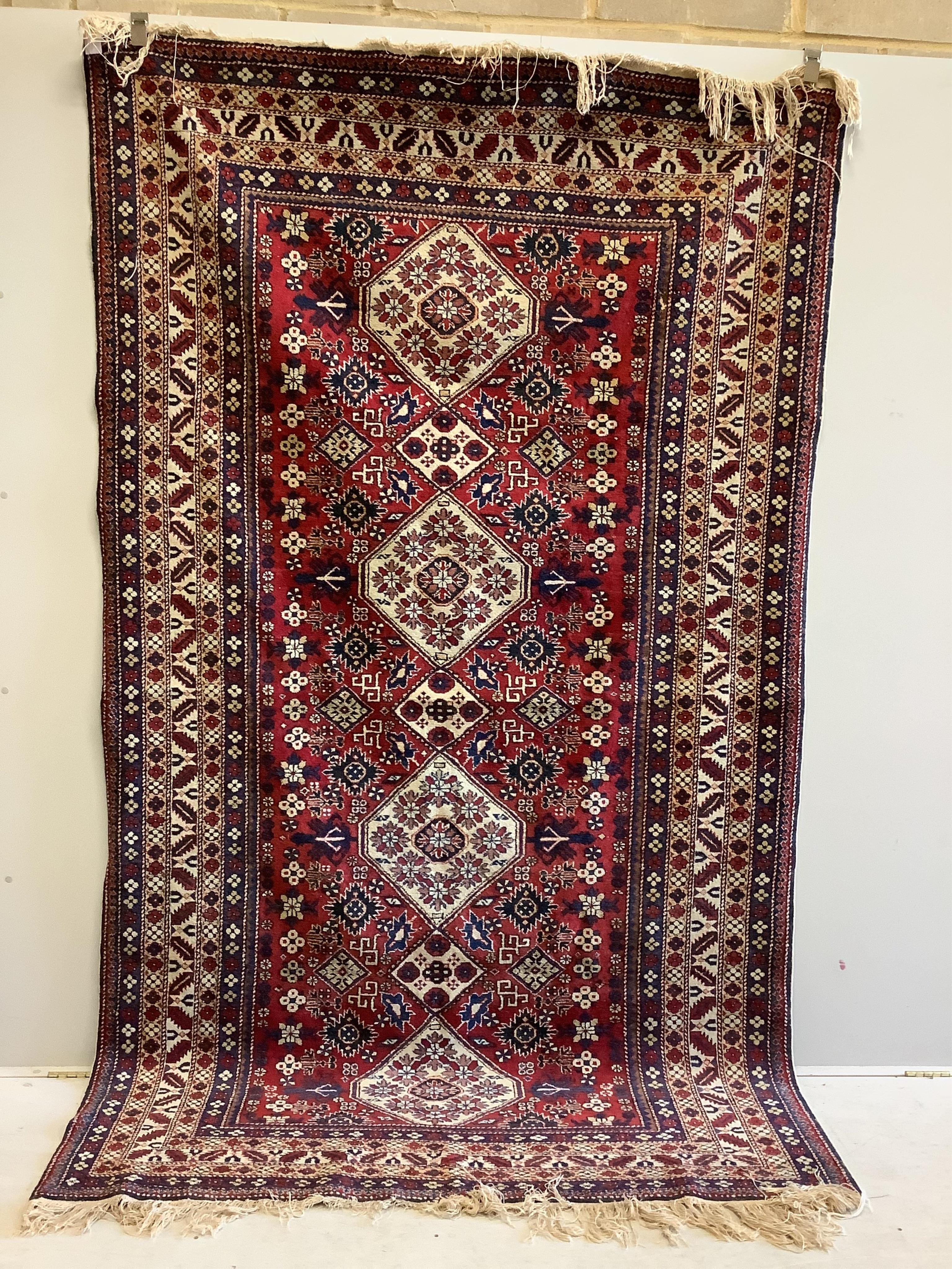 A Kazak red ground rug, 280 x 163cm. Condition - good